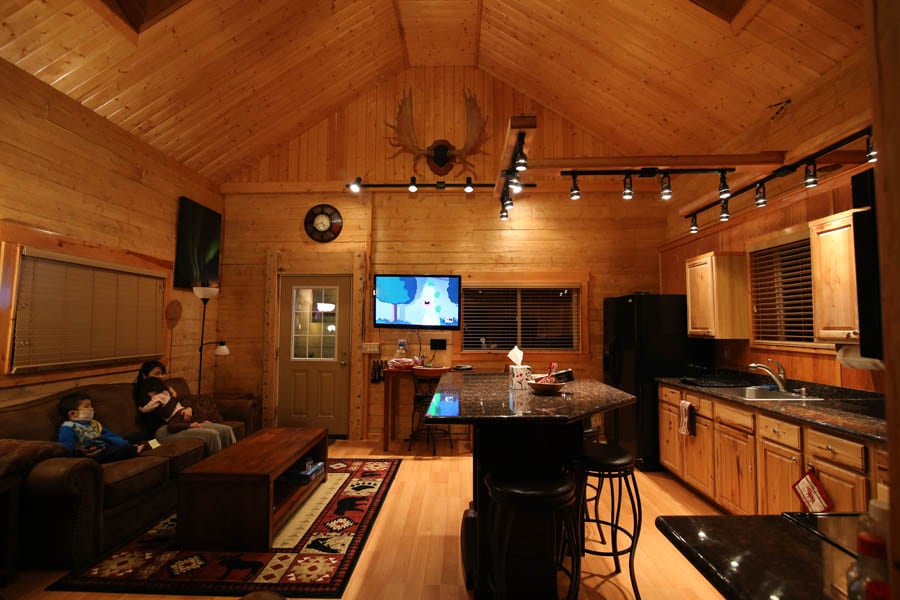 Warm wood-lined interior of Logan’s Chalet