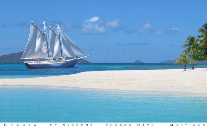 The wooden schooner Friendship Rose at anchor in turquoise Caribbean water
